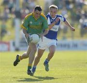 15 July 2006; Peter Curran, Meath, in action against Ross Munnelly, Laois. Bank of Ireland All-Ireland Senior Football Championship Qualifier, Round 3, Meath v Laois, Pairc Tailteann, Navan, Co. Meath. Picture credit: Brendan Moran / SPORTSFILE