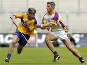 23 July 2006; Jonathan Clancy, Clare, in action against Declan Ruth, Wexford. Guinness All-Ireland Senior Hurling Championship Quarter-Final, Clare v Wexford, Croke Park, Dublin. Picture credit: Matt Browne / SPORTSFILE
