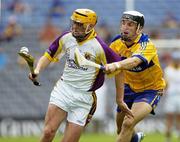 23 July 2006; Eoin Quigley, Wexford, in action against Gerry Quinn, Clare. Guinness All-Ireland Senior Hurling Championship Quarter-Final, Clare v Wexford, Croke Park, Dublin. Picture credit: Ray McManus / SPORTSFILE