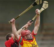 23 July 2006; Colin Hughes, Carlow, in action against Andy Savage, Down. Christy Ring Cup Semi-Final, Down v Carlow, Cusack Park, Mullingar, Co. Westmeath. Picture credit: David Maher / SPORTSFILE