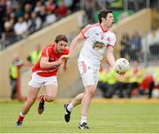 28 June 2014; Sean Cavanagh, Tyrone, in action against Derek Crilly, Louth. GAA Football All Ireland Senior Championship, Round 1B, Tyrone v Louth, Healy Park, Omagh, Co. Tyrone. Picture credit: Oliver McVeigh / SPORTSFILE