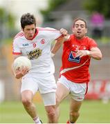 28 June 2014; Sean Cavanagh, Tyrone, in action against John O'Brien, Louth. GAA Football All Ireland Senior Championship, Round 1B, Tyrone v Louth, Healy Park, Omagh, Co. Tyrone. Picture credit: Oliver McVeigh / SPORTSFILE