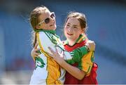 30 June 2014: Sinead Moren, left, and Eva Mulhall, from Ballylinan, Co. Laois, enjoy the Gaelic4Girls National Blitz Day in sun soaked Croke Park. The LGFA also announced their official new football boot. The vibrant pink football boots are on sale through the LGFA website and cost only €30 with clubs receiving 10% cashback on every order over 24 pairs. The new boots are produced by Kerry based and Irish owned company, RClub Sports. Picture credit: Stephen McCarthy / SPORTSFILE