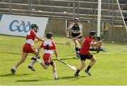 29 June 2014: Malachy McGee, Down, scores his side's third goal of the game despite the efforts of Ruairi McCloskey, left, Eugene McGuckin, centre, and Darrell McDermott, Derry. Ulster GAA Hurling Senior Championship, Quarter-Final, Down v Derry, St Tiernach's Park, Clones, Co. Monaghan. Picture credit: Ramsey Cardy / SPORTSFILE