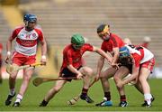29 June 2014: Michael Hughes, left, and Patrick Hughes, Down, in action against Paddy McCloskey, left, and Jonathan O'Dwyer, Derry. Ulster GAA Hurling Senior Championship, Quarter-Final, Down v Derry, St Tiernach's Park, Clones, Co. Monaghan. Picture credit: Ramsey Cardy / SPORTSFILE