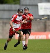 29 June 2014: Eugene McGuckin, Derry, in action against James Coyle, Down. Ulster GAA Hurling Senior Championship, Quarter-Final, Down v Derry, St Tiernach's Park, Clones, Co. Monaghan. Picture credit: Ramsey Cardy / SPORTSFILE