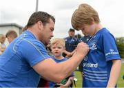 2 July 2014; Barry Kennedy, aged 9, from Harold's Cross, Dublin, gets his jersy signed by Leinster's Cian Healy during the Herald Leinster Rugby Summer Camps in Old Belvedere RFC, Donnybrook, Dublin. Picture credit: Barry Cregg / SPORTSFILE