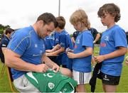 2 July 2014; Evan Boland, aged 9, from Blessington, Co. Wicklow, gets his jersy signed by Leinster's Cian Healy as Tomás Farthing, aged 9, from Sandymount, Dublin, waits his turn during the Herald Leinster Rugby Summer Camps in Old Belvedere RFC, Donnybrook, Dublin. Picture credit: Barry Cregg / SPORTSFILE
