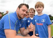 2 July 2014; Leinster's Cian Healy with Josh Buckley, centre, aged 8, from Kilternan, Dublin, and Alistair Verdon aged 8, from Glasnevin, Dublin, during the Herald Leinster Rugby Summer Camps in Old Belvedere RFC, Donnybrook, Dublin. Picture credit: Barry Cregg / SPORTSFILE