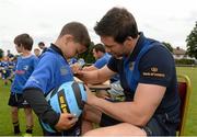 2 July 2014; Maxime Cauchi, aged 6, from Blackrock, Dublin, gets his jersy signed by Leinster's Kevin McLaughlin during the Herald Leinster Rugby Summer Camps in Old Belvedere RFC, Donnybrook, Dublin. Picture credit: Barry Cregg / SPORTSFILE