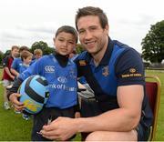 2 July 2014; Maxime Cauchi, aged 6, from Blackrock, Dublin, with Leinster's Kevin McLaughlin during the Herald Leinster Rugby Summer Camps in Old Belvedere RFC, Donnybrook, Dublin. Picture credit: Barry Cregg / SPORTSFILE