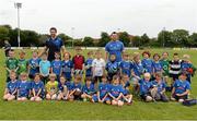 2 July 2014; Leinster's Cian Healy and Kevin McLaughlin with the 6 and 7's group during the Herald Leinster Rugby Summer Camps in Old Belvedere RFC, Donnybrook, Dublin. Picture credit: Barry Cregg / SPORTSFILE
