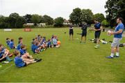 2 July 2014; Leinster's Cian Healy and Kevin McLaughlin answer questions from the 8 and 9's group during the Herald Leinster Rugby Summer Camps in Old Belvedere RFC, Donnybrook, Dublin. Picture credit: Barry Cregg / SPORTSFILE