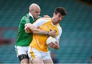 5 July 2014; Niall McKeever, Antrim, in action against Killian Phair, Limerick. GAA Football All-Ireland Senior Championship, Round 2A, Limerick v Antrim, Gaelic Grounds, Limerick. Picture credit: Brendan Moran / SPORTSFILE