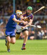 5 July 2014; Conor McGrath, Clare, in action against Matthew O'Hanlon, Wexford. GAA Hurling All-Ireland Senior Championship, Round 1, Clare v Wexford, Cusack Park, Ennis, Co. Clare. Picture credit: Ray McManus / SPORTSFILE