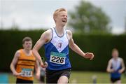 5 July 2014; Peter Kilgallon, Ratoath AC, crosses the finish line to win the Boy's U17 4x400m final event. GloHealth AAI Juvenile Track and Field Relay Championships, Tullamore, Co. Offaly. Picture credit: Pat Murphy / SPORTSFILE