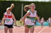 5 July 2014; Lauren O'Leary, Emerald AC, right, crosses the finish line to win the Girl's U15 4x100m final event. GloHealth AAI Juvenile Track and Field Relay Championships, Tullamore, Co. Offaly. Picture credit: Pat Murphy / SPORTSFILE
