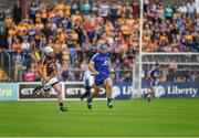 5 July 2014;  Conor Ryan, Clare, in action against Ciarán Kenny, Wexford. GAA Hurling All-Ireland Senior Championship, Round 1, Clare v Wexford, Cusack Park, Ennis, Co. Clare. Picture credit: Ray McManus / SPORTSFILE