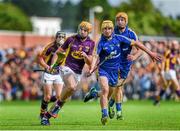 5 July 2014; David Redmond, Wexford, is tackled by Colm Galvin, Clare. GAA Hurling All-Ireland Senior Championship, Round 1, Clare v Wexford, Cusack Park, Ennis, Co. Clare. Picture credit: Ray McManus / SPORTSFILE