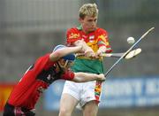 23 July 2006; Colin Hughes, Carlow, in action against Gerard Adair, Down. Christy Ring Cup Semi-Final, Down v Carlow, Cusack Park, Mullingar, Co. Westmeath. Picture credit: David Maher / SPORTSFILE *** Local Caption *** Colin Hughes