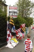 22 July 2006; A Cork supporter walks past a stall selling team colours. Guinness All-Ireland Senior Hurling Championship Quarter-Final, Cork v Limerick, Semple Stadium, Thurles, Co. Tipperary. Picture credit: Damien Eagers / SPORTSFILE