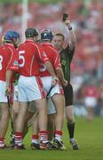 22 July 2006; Cork players Tom Kenny, left, John Gardiner and Ronan Curran confront referee Diarmuid Kirwan as he issues a &quot;tick&quot; to one of them. Guinness All-Ireland Senior Hurling Championship Quarter-Final, Cork v Limerick, Semple Stadium, Thurles, Co. Tipperary. Picture credit: Brendan Moran / SPORTSFILE