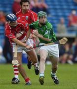 22 July 2006; Andrew O'Shaughnessy, Limerick, in action against Ronan Curran and Sean Og O hAilpin, Cork. Guinness All-Ireland Senior Hurling Championship Quarter-Final, Cork v Limerick, Semple Stadium, Thurles, Co. Tipperary. Picture credit: Brendan Moran / SPORTSFILE