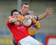 25 July 2006;  Brian White, Louth, in action against Alan Clohessy, Clare. Tommy Murphy Cup, Round 1, Clare v Louth, Cusack Park, Ennis, Co. Clare. Picture credit: Kieran Clancy / SPORTSFILE