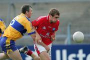 25 July 2006; Paddy Keenan, Louth, is tackled bty Brian Considine, Clare. Tommy Murphy Cup, Round 1, Clare v Louth, Cusack Park, Ennis, Co. Clare. Picture credit: Kieran Clancy / SPORTSFILE