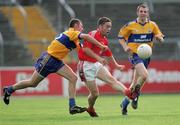 25 July 2006; John O'Brien, Louth, in action against Alan Clohessy, Clare. Tommy Murphy Cup, Round 1, Clare v Louth, Cusack Park, Ennis, Co. Clare. Picture credit: Kieran Clancy / SPORTSFILE