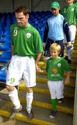 24 July 2006; Republic of Ireland captain Alan O'Hara leads his team out with team mascot Cian Crossin. Cerebral Palsy European Soccer Championships, Republic of Ireland v Spain, Belfield Bowl, UCD, Dublin. Picture credit: Pat Murphy / SPORTSFILE