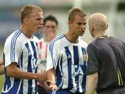 27 July 2006; IFK Gothenburg players Adam Johannsson, left and Nicolas Alexandersson remonstrate with referee Gardar Hinriksson after his penalty decision, in favour of IFK Gothenburg, was overturned by an assistant referee. UEFA Cup 1st Round, 2nd Leg, Derry City v IFK Gotheburg, Brandywell, Derry. Picture credit; David Maher / SPORTSFILE