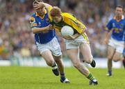 29 July 2006; Colm Cooper, Kerry, holds off the challenge of Cathal Conefrey, Longford. Bank of Ireland All-Ireland Senior Football Championship Qualifier, Round 4, Kerry v Longford, Fitzgerald Stadium, Killarney, Co. Kerry. Picture credit; Brendan Moran / SPORTSFILE