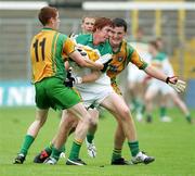 29 July 2006; Diarmuid Horan, Offaly in action against Dualtach Molly and Michael Murphy, Donegal,. ESB All-Ireland Minor Football Championship Quarter-Final, Donegal v Offaly, St Tighearnach's Park Clones, Co. Monaghan. Picture credit; Oliver McVeigh / SPORTSFILE