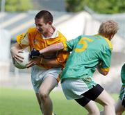 29 July 2006; Kevin McBride, Antrim, in action against David Donegan, Meath. ESB All-Ireland Minor Football Championship Quarter-Final, Meath v Antrim, St Tighearnach's Park Clones, Co. Monaghan. Picture credit; Oliver McVeigh / SPORTSFILE