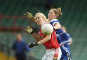 29 July 2006; Nollaig Cleary, Cork, in action against Michelle McGrath, Waterford. TG4 Ladies Munster Senior Football Final, Cork v Waterford, Gaelic Grounds, Limerick. Picture credit; Brendan Moran / SPORTSFILE