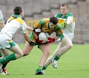 29 July 2006; Michael Murphy, Donegal, in action against Liam Brennan and Sean Pender, right, Offaly. ESB All-Ireland Minor Football Championship Quarter-Final, Donegal v Offaly, St Tighearnach's Park Clones, Co. Monaghan. Picture credit; Oliver McVeigh / SPORTSFILE