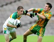 29 July 2006; Conor Mahon, Offaly, in action against Leo McLoone, Donegal. ESB All-Ireland Minor Football Championship Quarter-Final, Donegal v Offaly, St Tighearnach's Park Clones, Co. Monaghan. Picture credit; Oliver McVeigh / SPORTSFILE