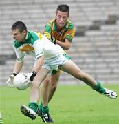 29 July 2006; Bryan Lonergan, Offaly, in action against Leo McLoone, Donegal. ESB All-Ireland Minor Football Championship Quarter-Final, Donegal v Offaly, St Tighearnach's Park Clones, Co. Monaghan. Picture credit; Oliver McVeigh / SPORTSFILE