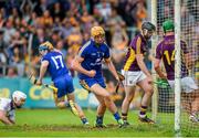5 July 2014;  Cian Dillon, Clare, centre, celebrates as his teammate Seadna Morey peals away after scoring their side's first goal of the game following a rebound from a saved penalty. GAA Hurling All-Ireland Senior Championship, Round 1, Clare v Wexford, Cusack Park, Ennis, Co. Clare. Picture credit: Ray McManus / SPORTSFILE
