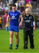 5 July 2014; Conor Ryan, Clare, leaves the field at the end of extra time with chartered physiotherapist Diarmuid Horgan. GAA Hurling All-Ireland Senior Championship, Round 1, Clare v Wexford, Cusack Park, Ennis, Co. Clare. Picture credit: Ray McManus / SPORTSFILE