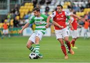 5 July 2014; Jason McGuinness, Shamrock Rovers, in action against Christy Fagan, St Patrick's Athletic. SSE Airtricity League Premier Division. Shamrock Rovers v St Patrick's Athletic. Tallaght Stadium, Tallaght, Co. Dublin. Picture credit: Ashleigh Fox / SPORTSFILE