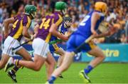 5 July 2014; Clare's Tony Kelly watches his strike, from the penalty spot late in the game, saved by the Wexford defence. GAA Hurling All-Ireland Senior Championship, Round 1, Clare v Wexford, Cusack Park, Ennis, Co. Clare. Picture credit: Ray McManus / SPORTSFILE