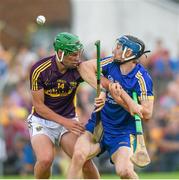 5 July 2014; David McInerney, Clare, in action against Conor McDonald, Wexford. GAA Hurling All-Ireland Senior Championship, Round 1, Clare v Wexford, Cusack Park, Ennis, Co. Clare. Picture credit: Ray McManus / SPORTSFILE
