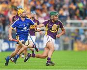 5 July 2014; Keith Rossiter, Wexford, in action against Colm Galvin, Clare. GAA Hurling All-Ireland Senior Championship, Round 1, Clare v Wexford, Cusack Park, Ennis, Co. Clare. Picture credit: Ray McManus / SPORTSFILE