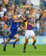 5 July 2014; Keith Rossiter, Wexford, in action against Colm Galvin, Clare. GAA Hurling All-Ireland Senior Championship, Round 1, Clare v Wexford, Cusack Park, Ennis, Co. Clare. Picture credit: Ray McManus / SPORTSFILE