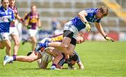 6 July 2014; PJ Banville, Wexford, in action against Denis Booth, right, and Paul Begley, Laois.  GAA Football All Ireland Senior Championship, Round 2A, Wexford v Laois, Wexford Park, Wexford. Picture credit: Barry Cregg / SPORTSFILE