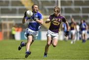6 July 2014; Billy Sheehan, Laois, in action against PJ Banville, Wexford.  GAA Football All Ireland Senior Championship, Round 2a, Wexford v Laois, Wexford Park, Wexford. Picture credit: Barry Cregg / SPORTSFILE