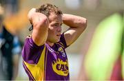 6 July 2014; A dejected Neil Ewing, Wexford, after the game.  GAA Football All Ireland Senior Championship, Round 2A, Wexford v Laois, Wexford Park, Wexford. Picture credit: Barry Cregg / SPORTSFILE