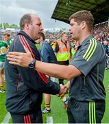 6 July 2014; Cork manager Brian Cuthbert and Kerry manager Eamonn Fitzmaurice exchange a handshake after the game. Munster GAA Football Senior Championship Final, Cork v Kerry, Páirc Ui Chaoimh, Cork. Picture credit: Diarmuid Greene / SPORTSFILE